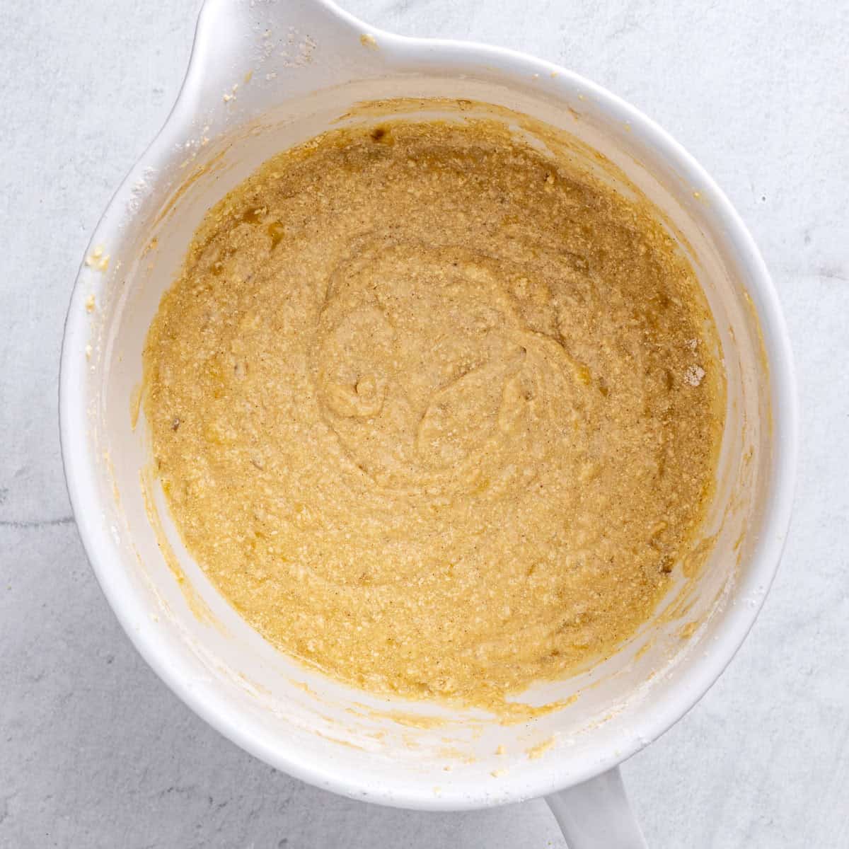 A bowl consisting of the batter ingredients after combined.