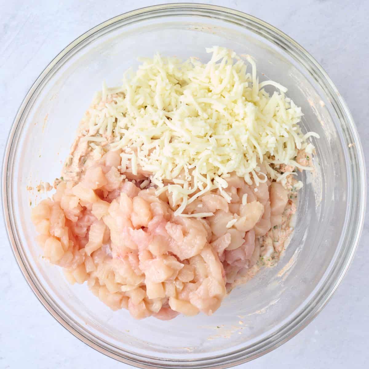 After whisking with chicken and mozzarella chicken added before combining.