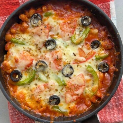 Pizza beans after baking with melty cheese.