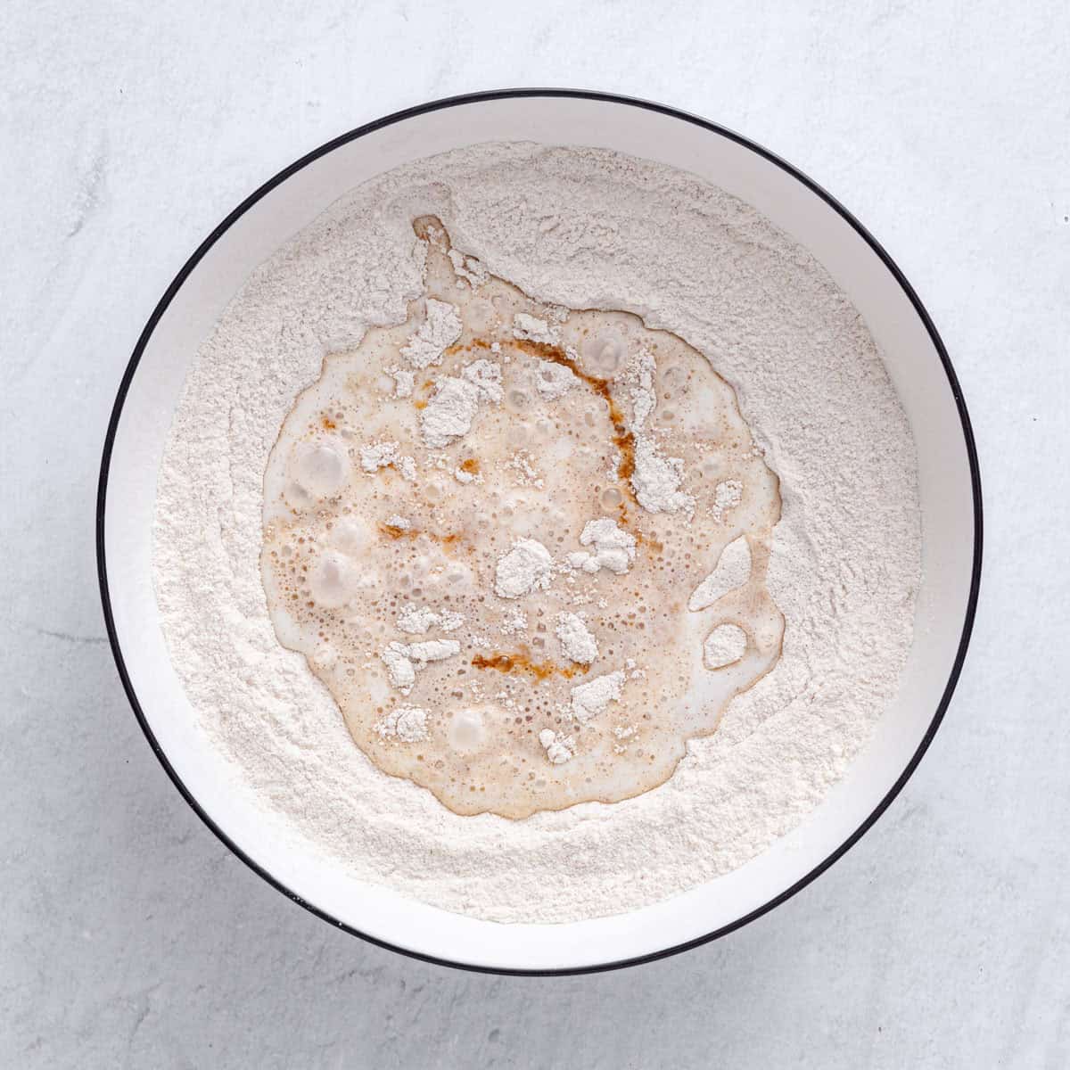 Milk and vanilla added to dry ingredients before mixing.