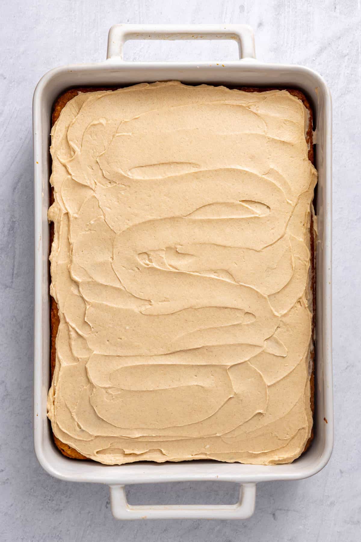 Frosting added on top of the cake.