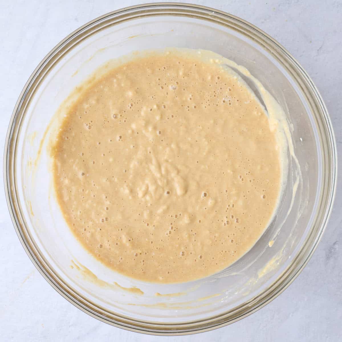 The batter in a bowl after fully mixed.