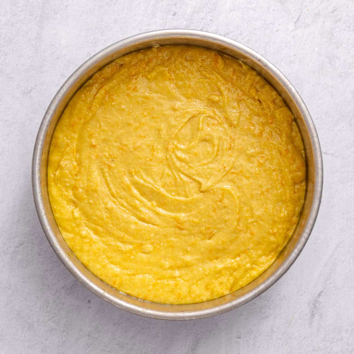 Batter added to prepared pan before baking.