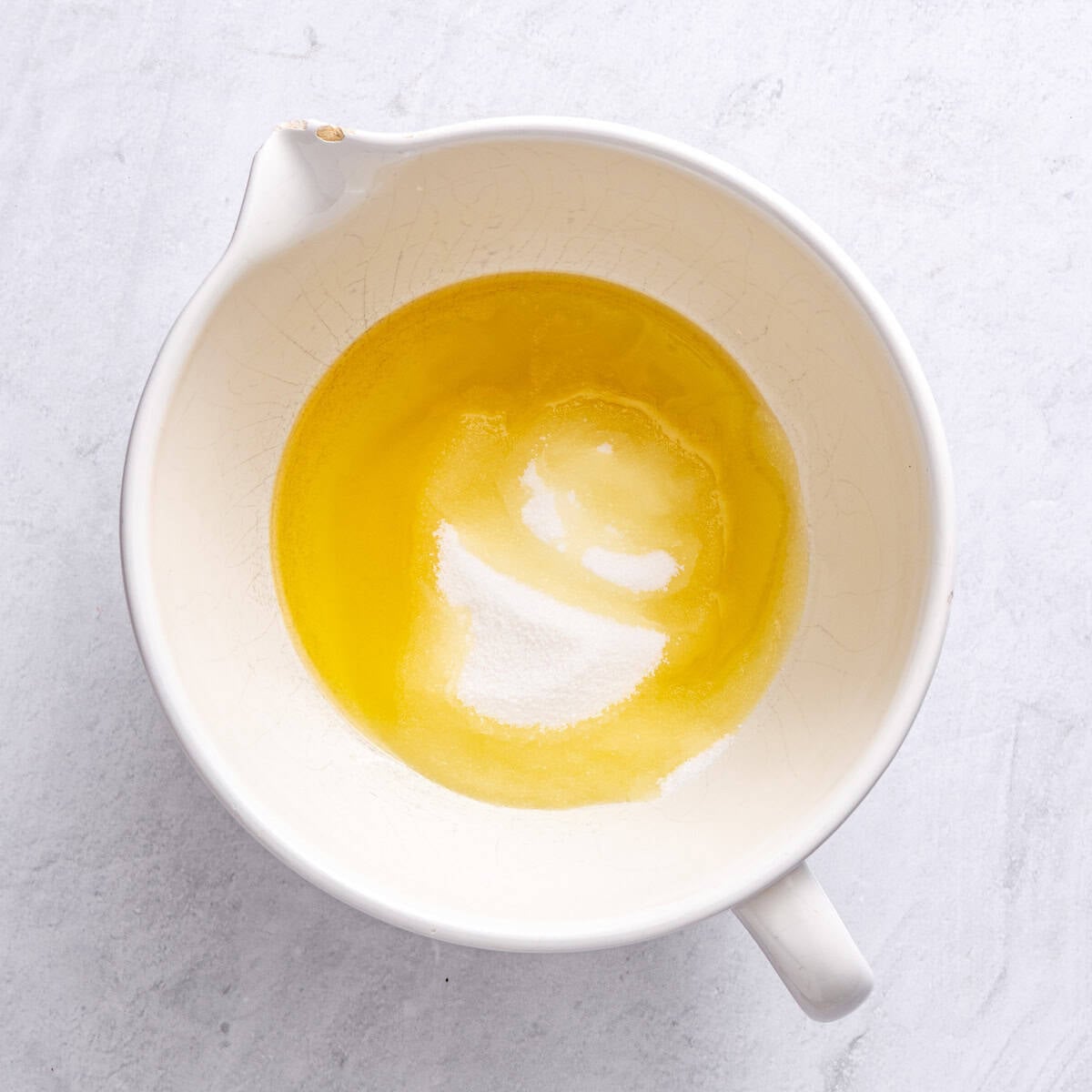 Oil and sugar in a large bowl.
